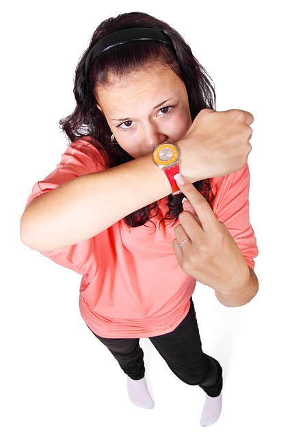 Person pointing to a watch